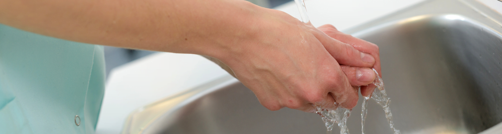 doctor washing hands during covid-19 outbreak